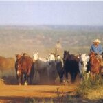 Cowboy scene with horses at ranch.