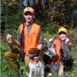 Boys, bird dogs and harvested game birds.